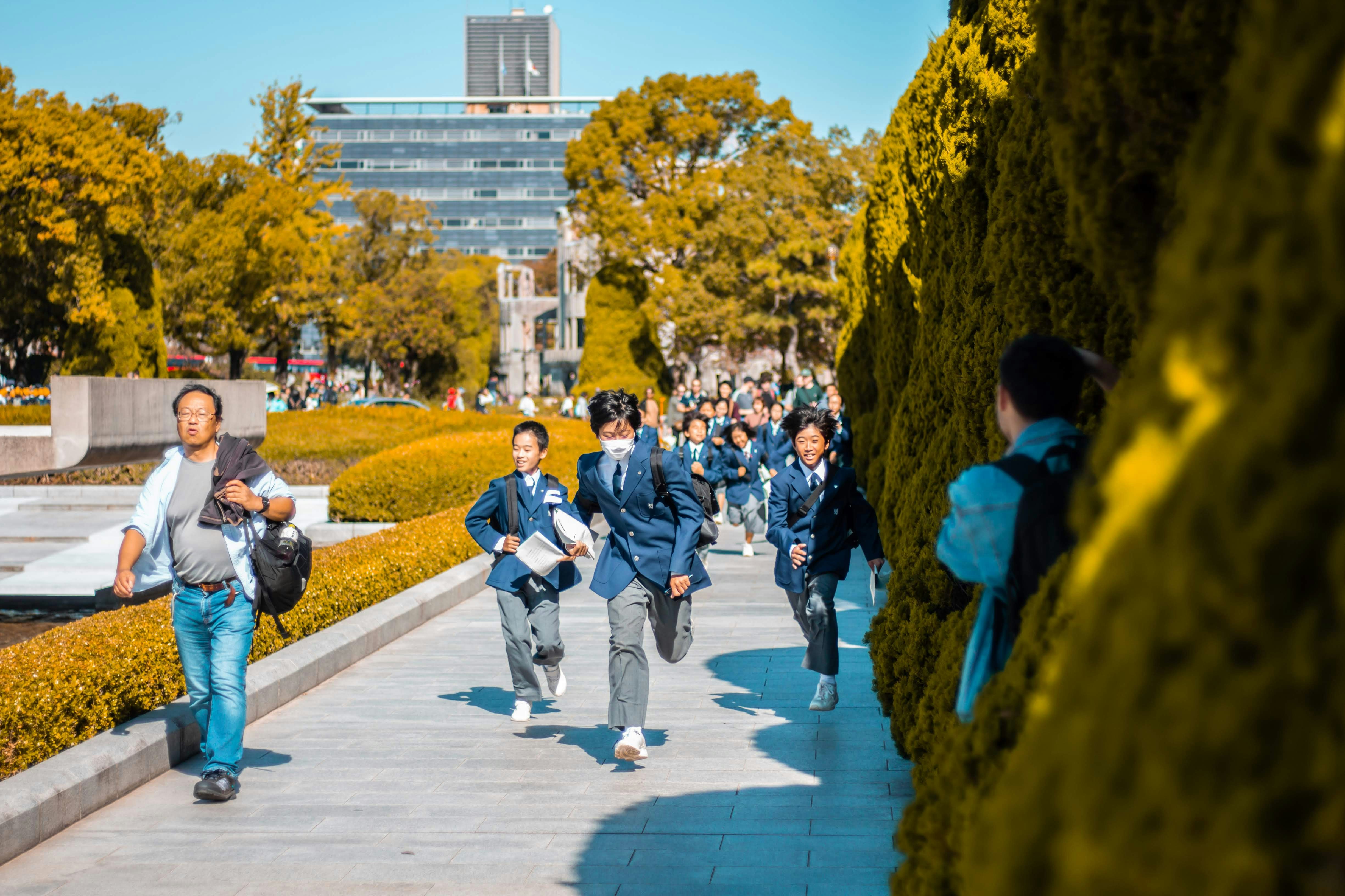 people walking on gray concrete pavement during daytime